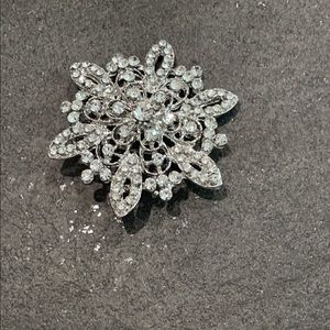 Silver rhinestone brooch